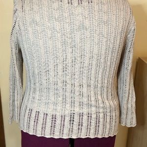 A crochet sweater with sewn in lining